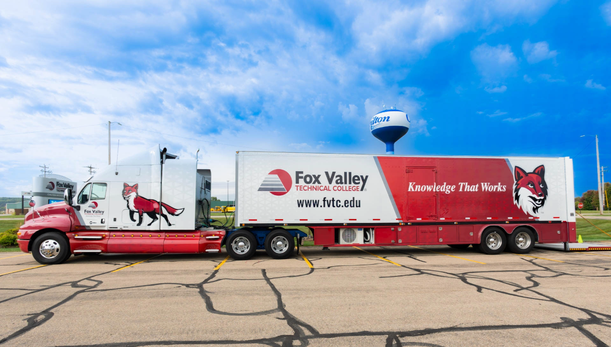 Semi truck with FVTC logo and Sly Fox on it.