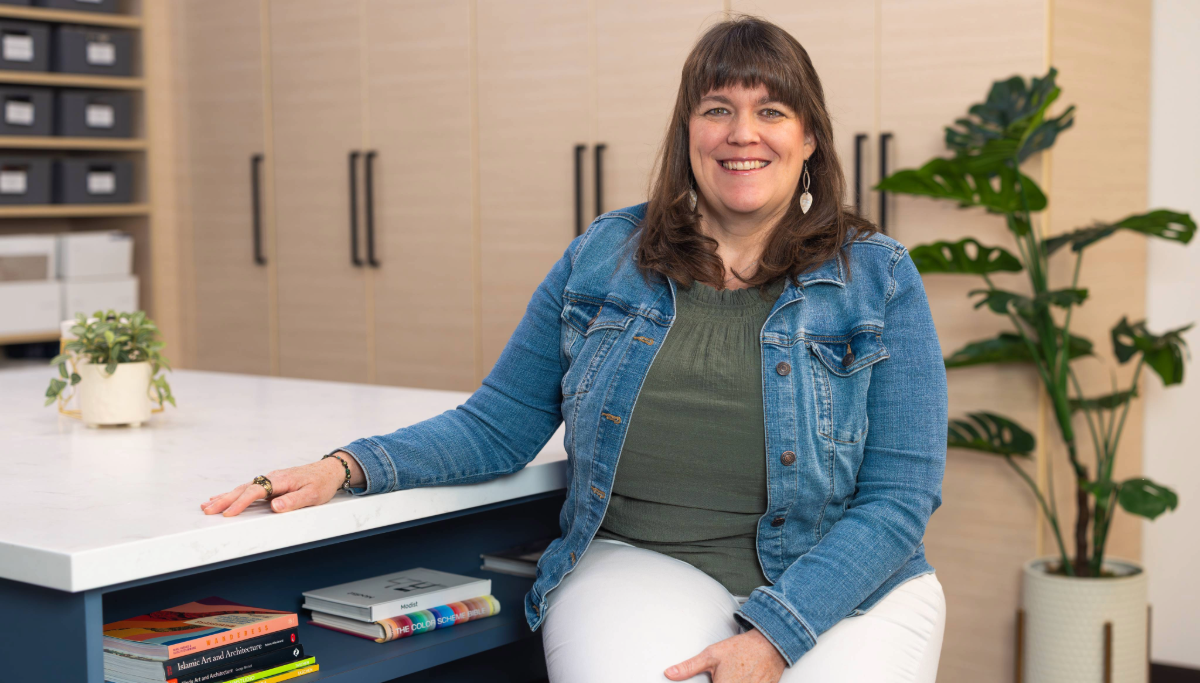 Interior Design Student smiling in the lighting lab.