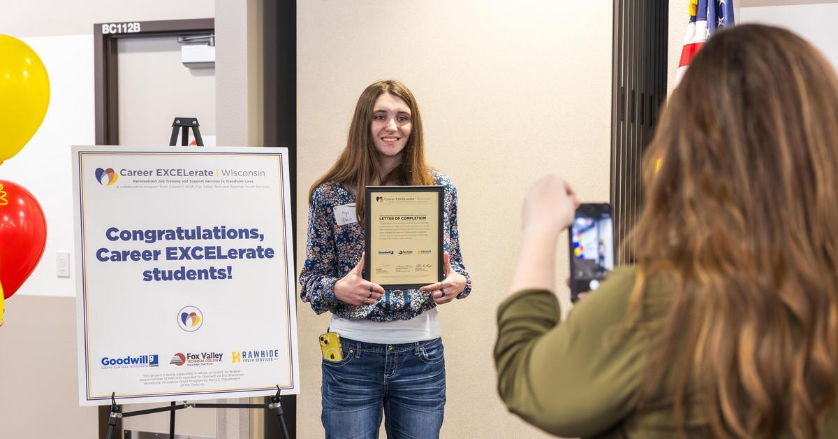 Student receiving a letter of completion