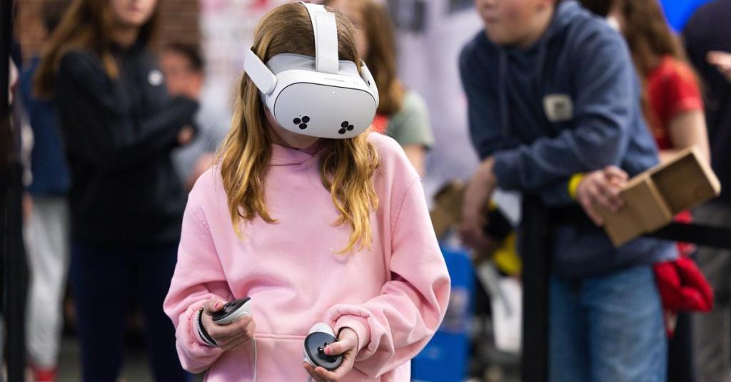 Students testing virtual reality goggles