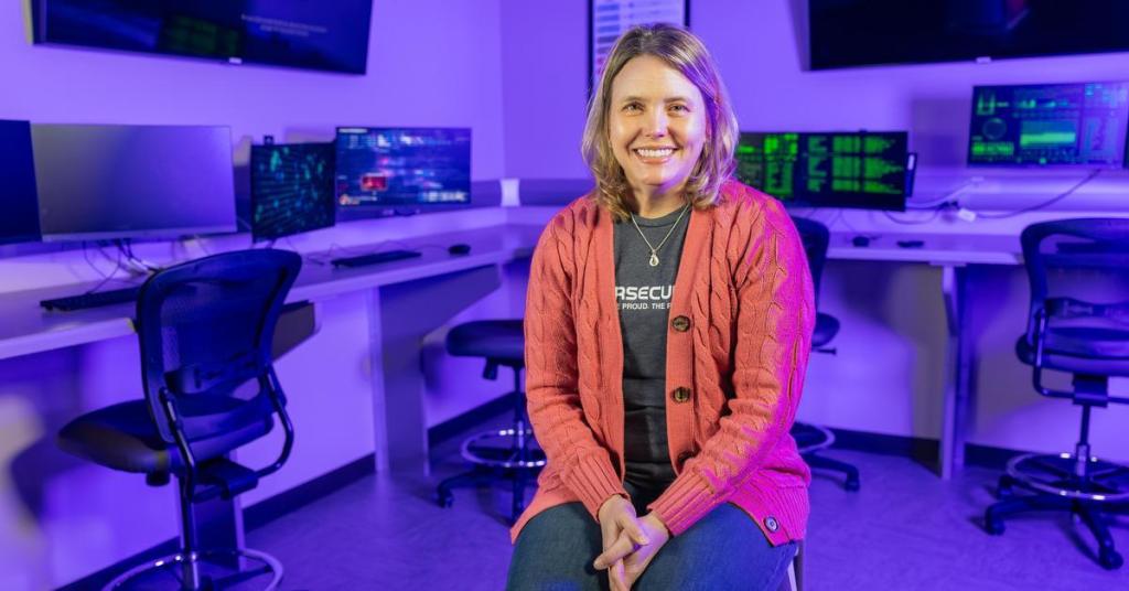 Faculty Spotlight Wendy Diem smiles for a portrait in an information technology lab.